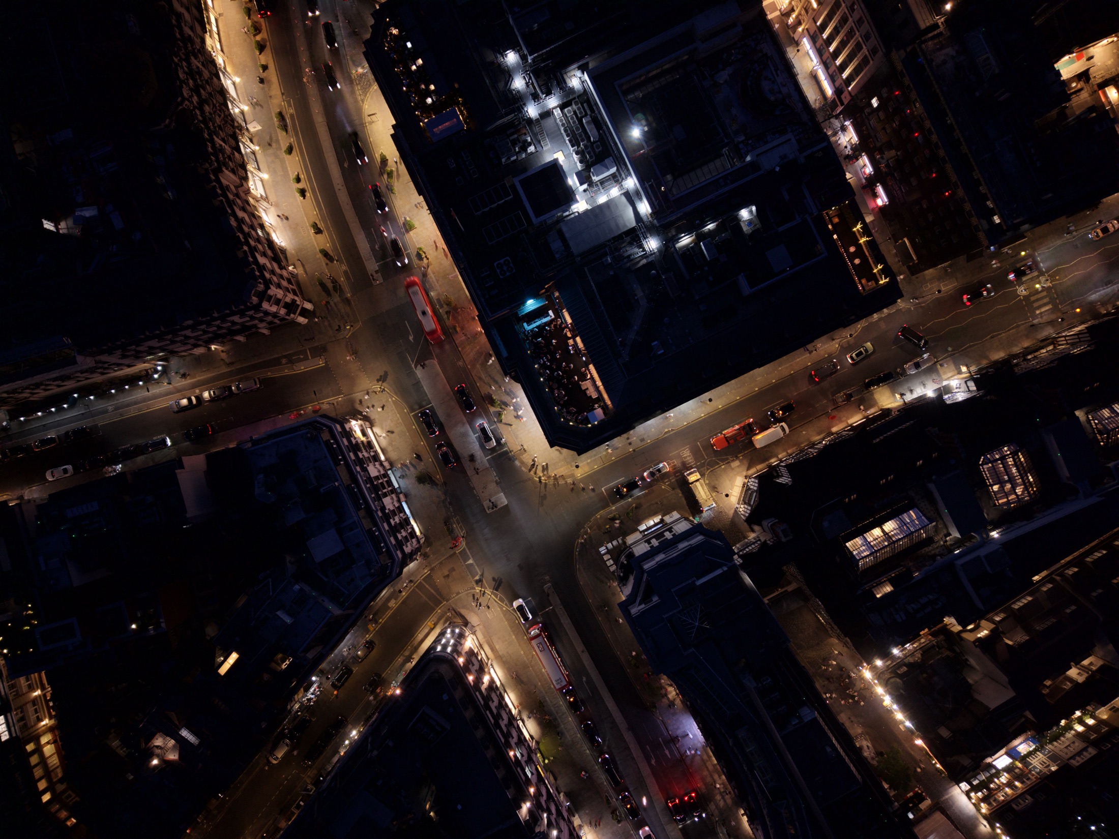 Aerial night photograph of central London streets and buildings viewed from above
