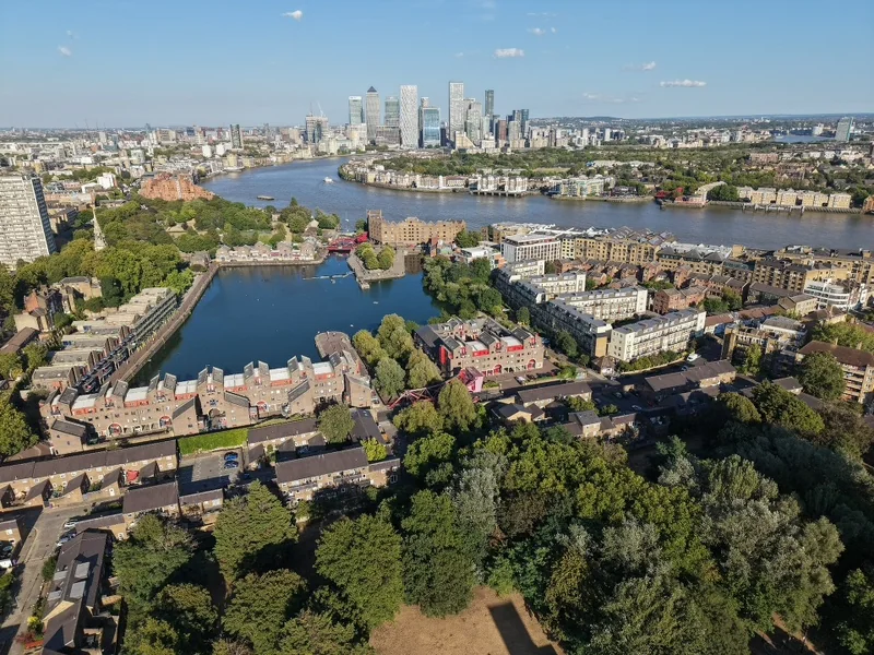 Aerial view of riverside docks and high-rise buildings in daylight