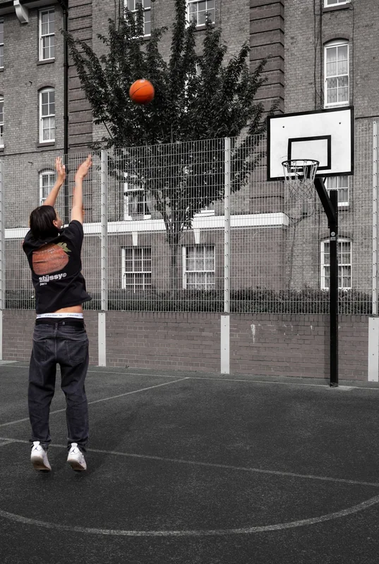 Basketball shot held at its apex