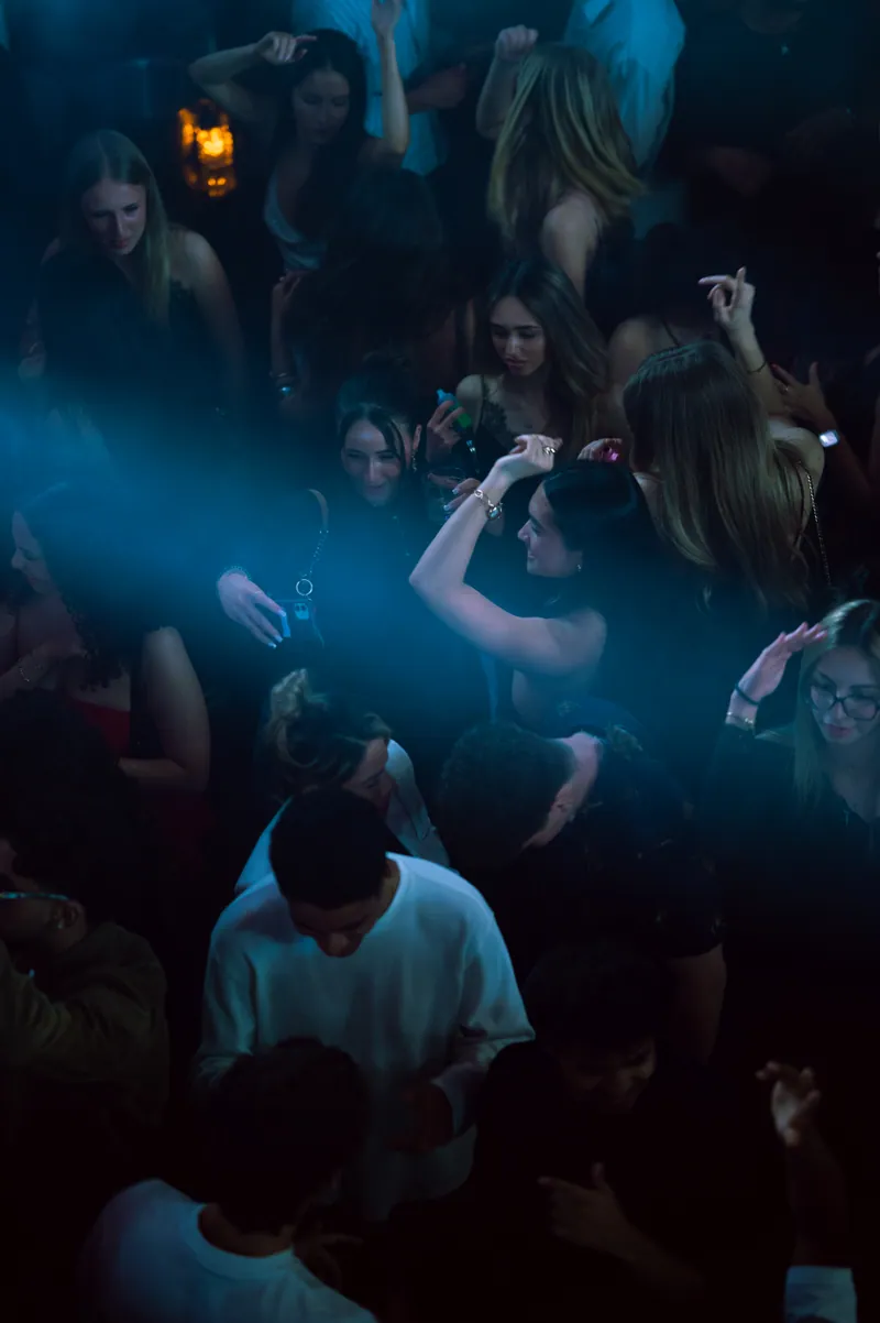 Dancers together on the floor in blue haze at 77 London