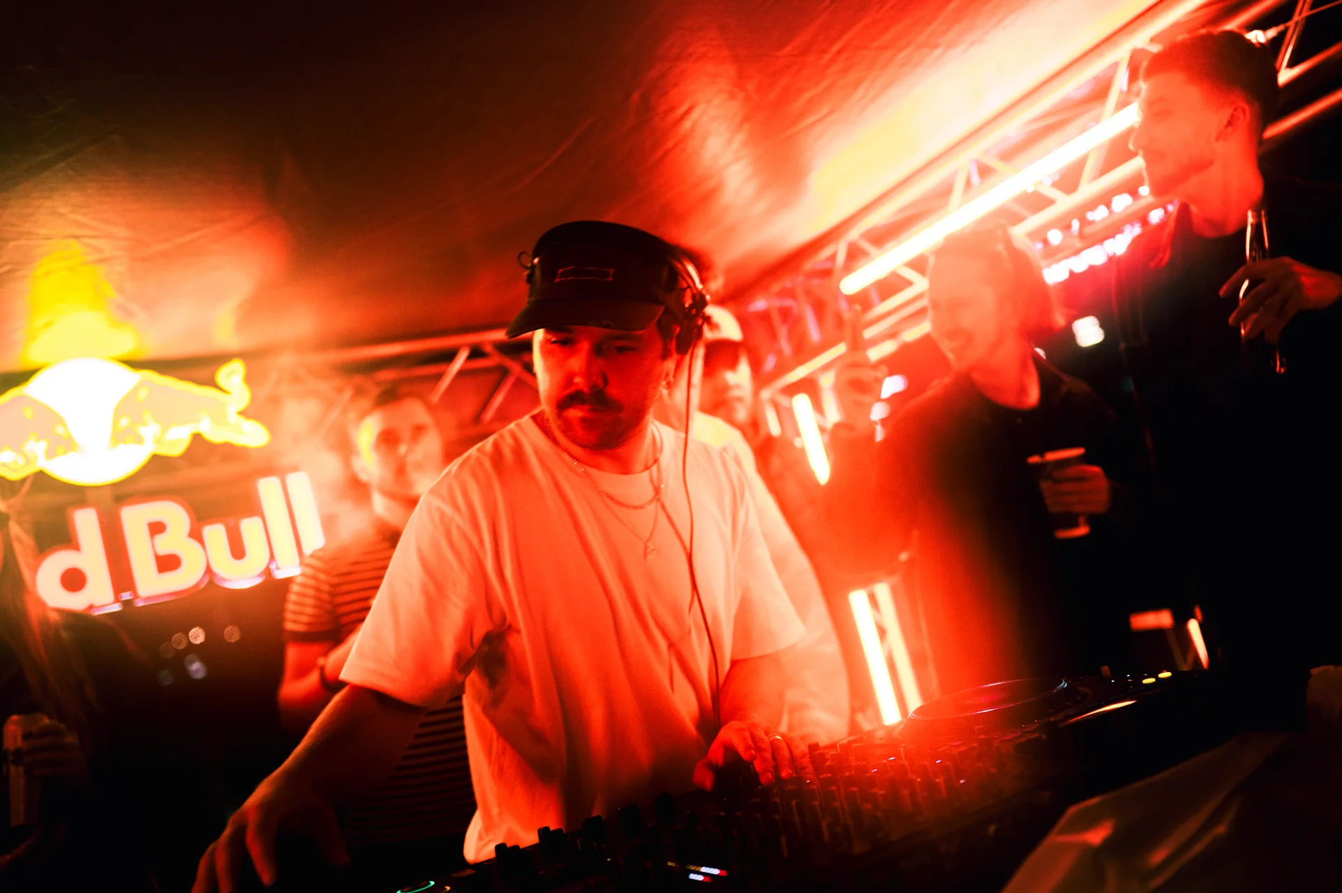 DJ performing under red light aboard the District boat