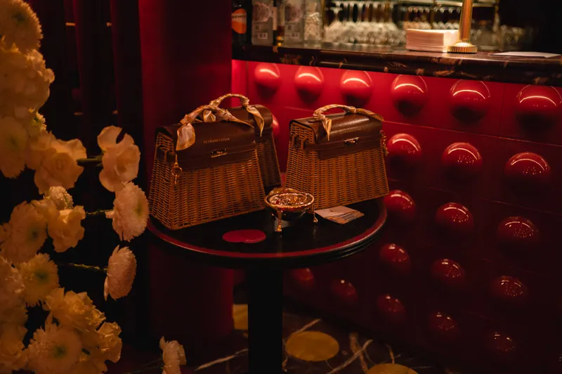FashionTV branded bags and flowers beside the red bar