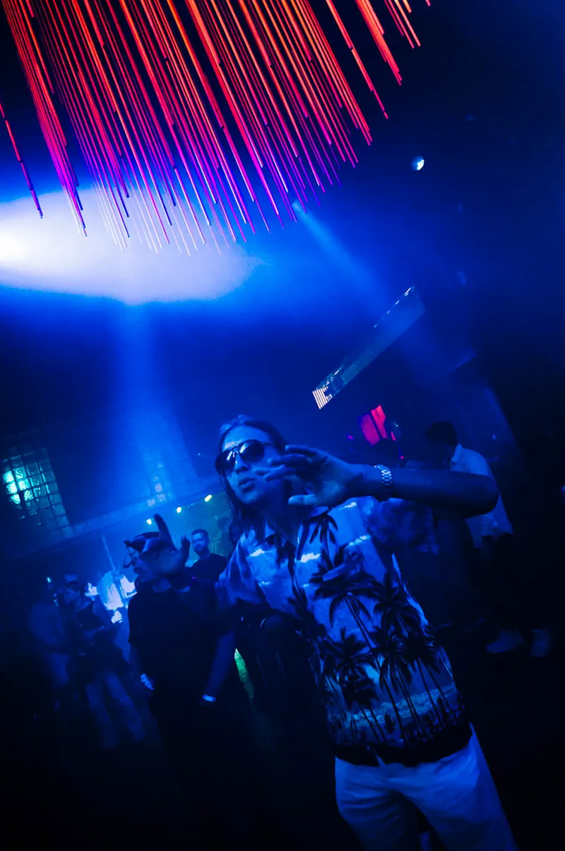 Dancer moving through blue light at Gallery 1986 in Vilnius