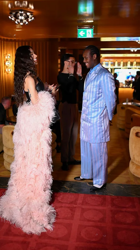 Guests talking beside the bar at FashionTV