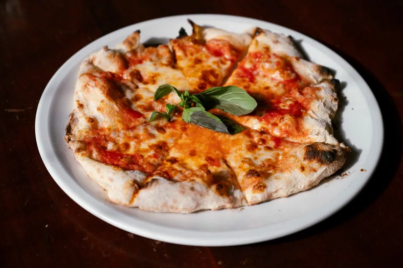 Freshly served margherita pizza at Bocca in Cielo