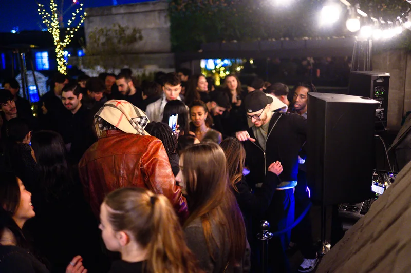 Nighttime crowd on the Aqua Nueva terrace