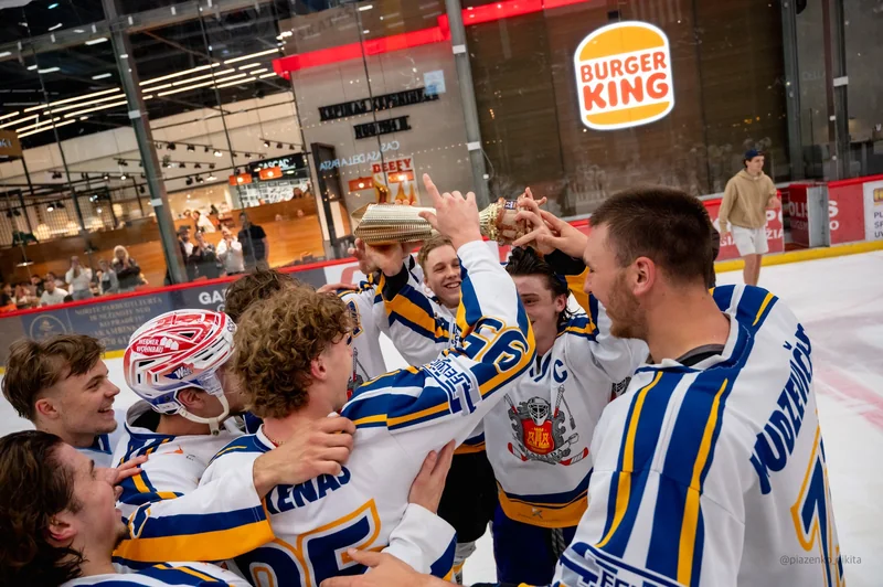 Players gather in a close team celebration after the action.