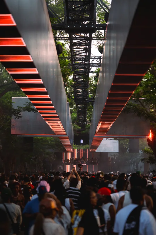 Red geometric stage canopy above the crowd at Highlights