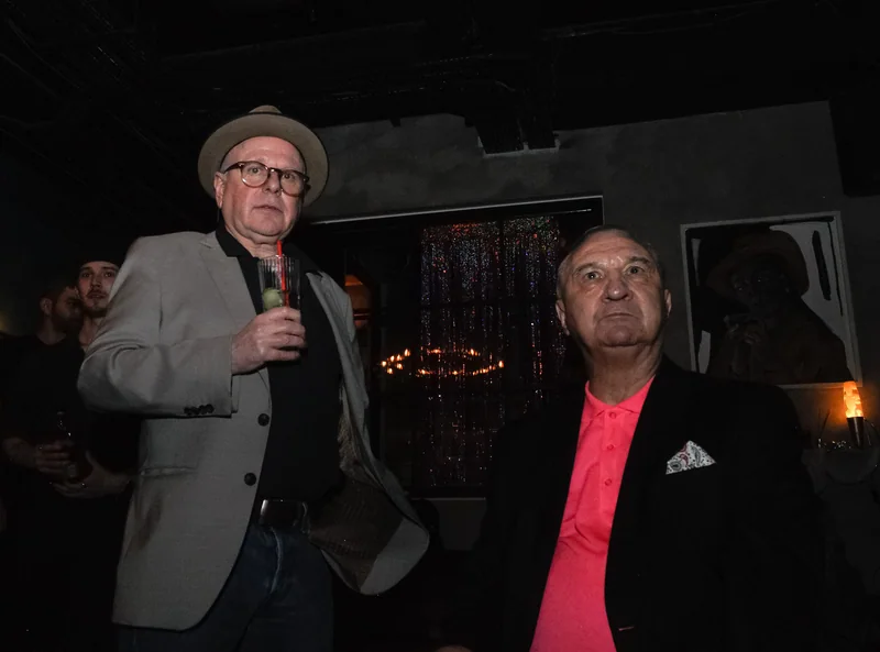 Two guests addressing the magazine launch with a microphone