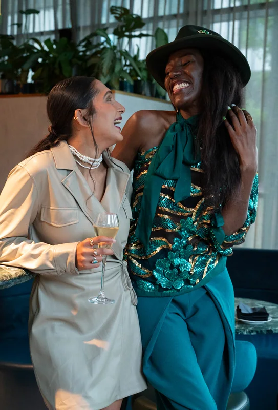 Two guests laughing together at The BoTree