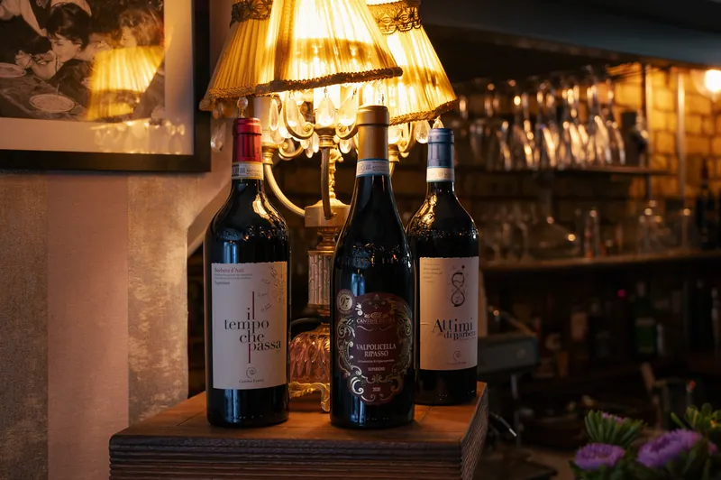 Wine bottles and warm lighting inside Bocca in Cielo